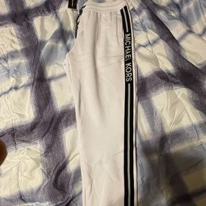 White and black Michael Kors joggers.